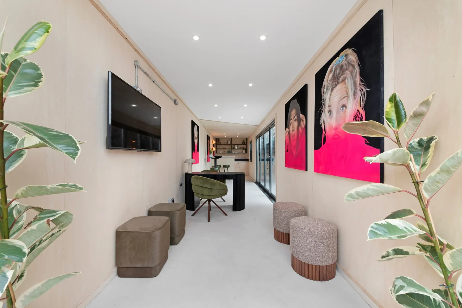 Commercial Unit 07 interior with colourful artwork, seating and plants