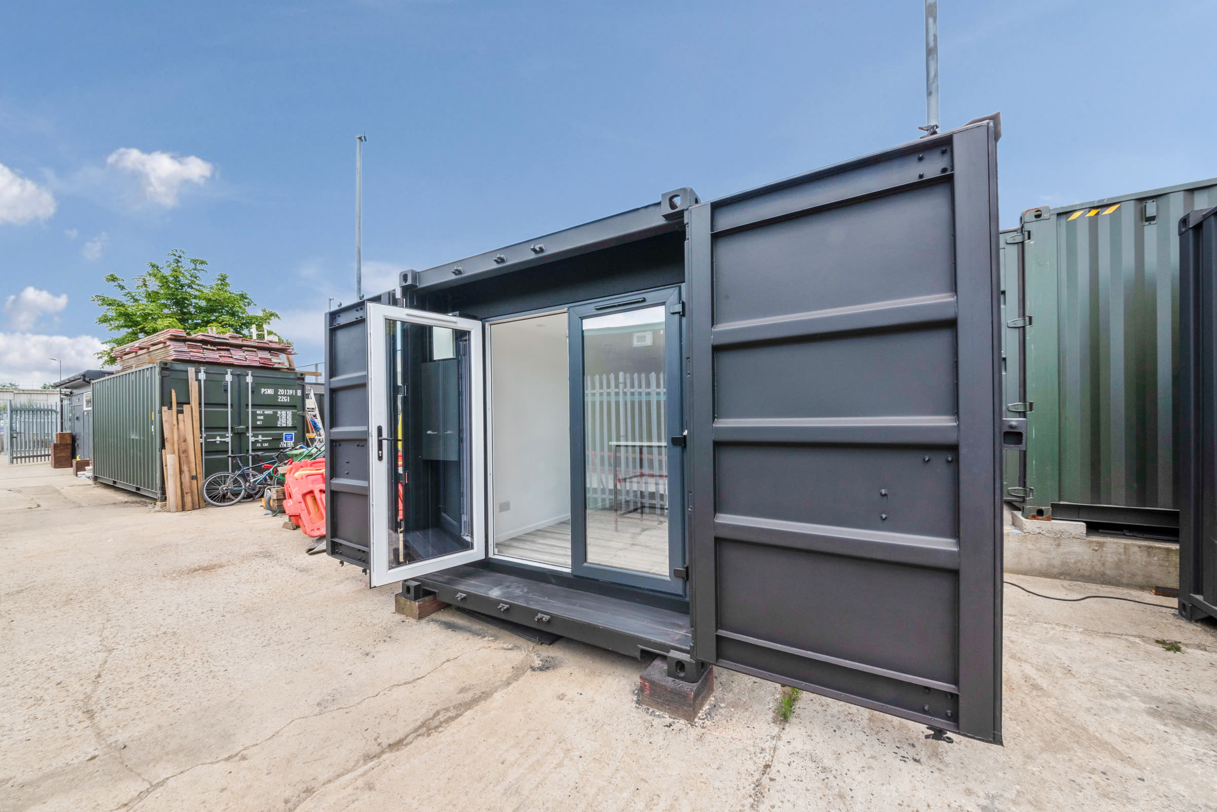 Compact 20 ft Roamify container unit with glazed entrance