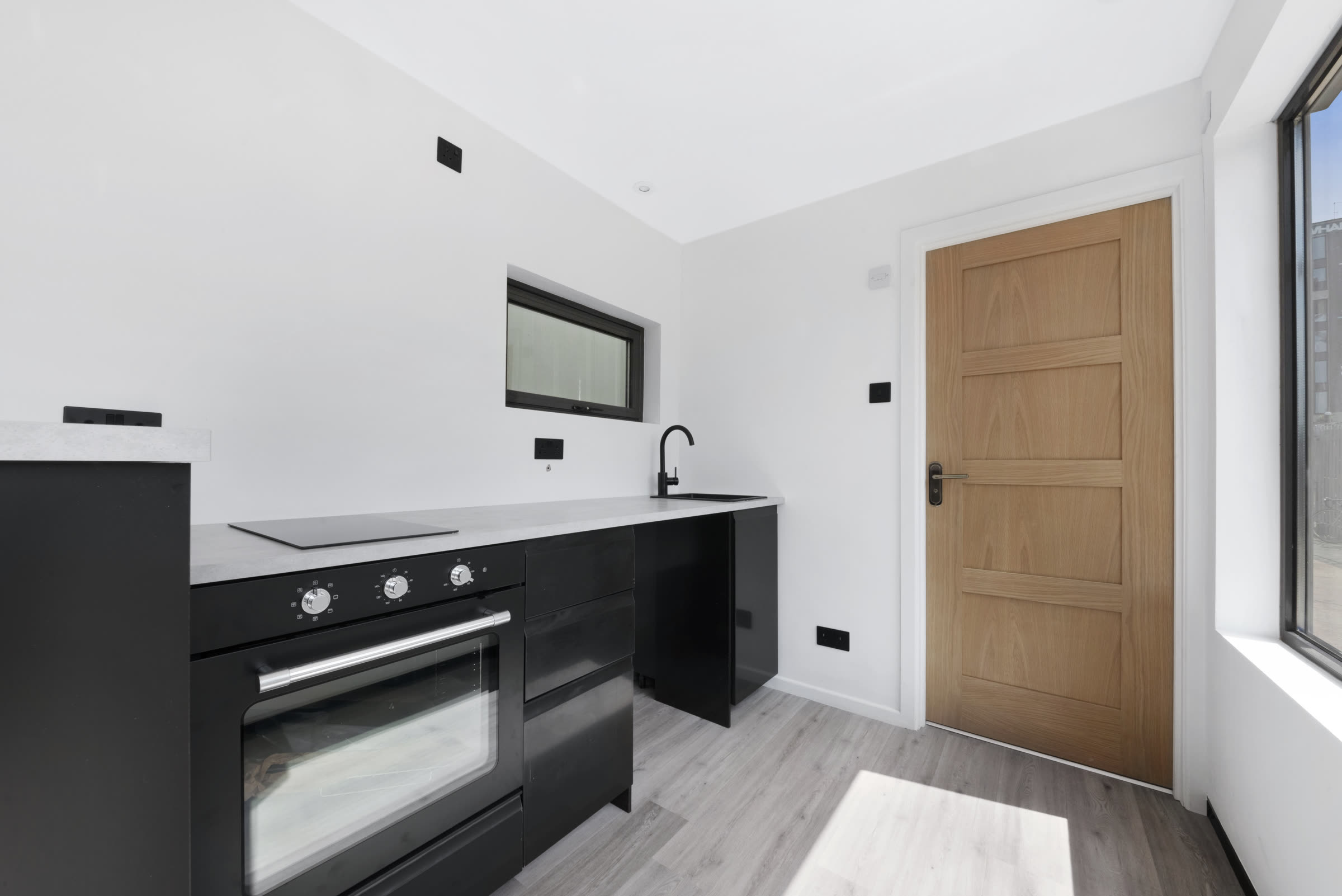 Compact fitted kitchen inside a Roamify modular building